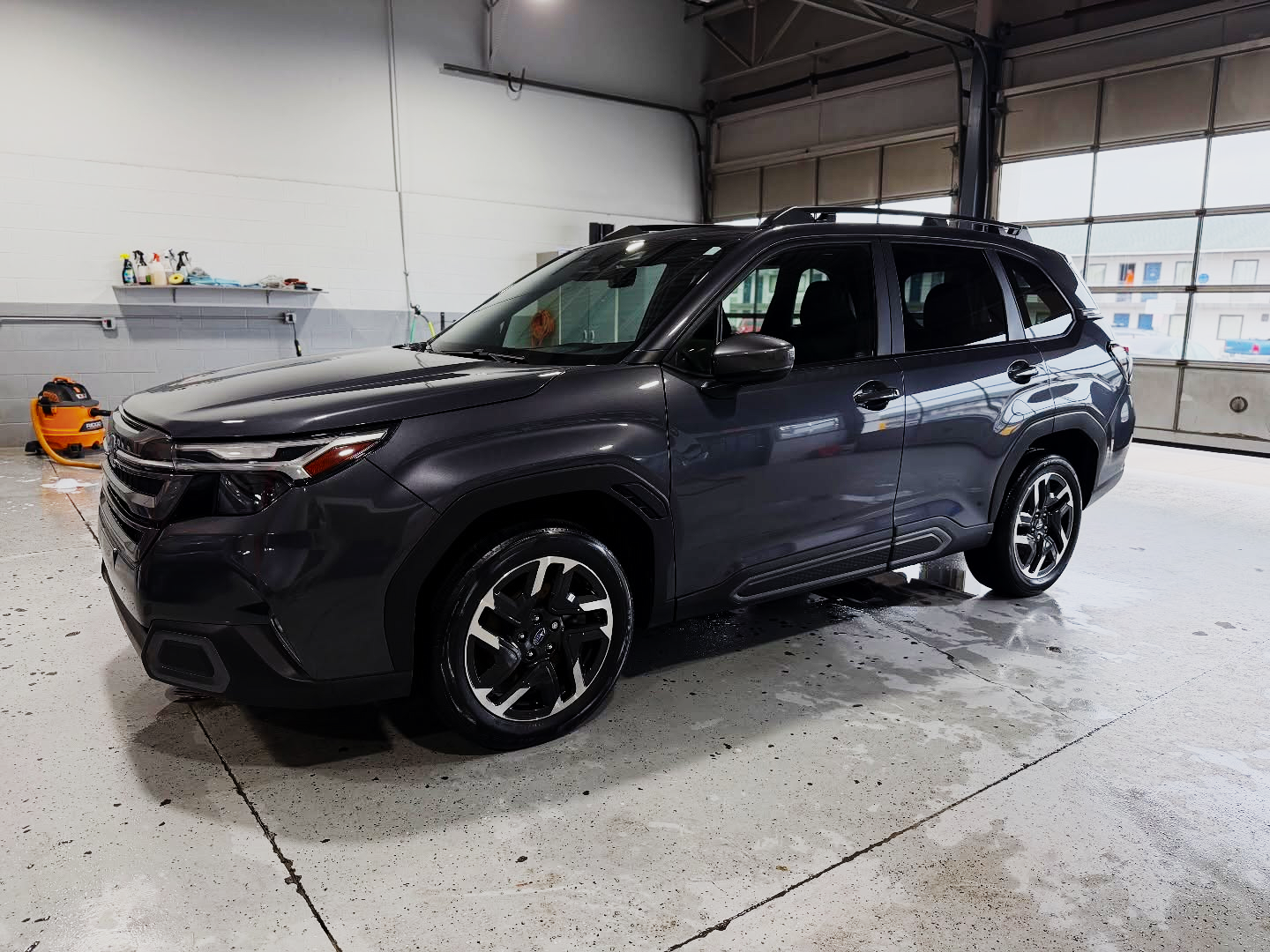 Gray SUV after ceramic coating in shop